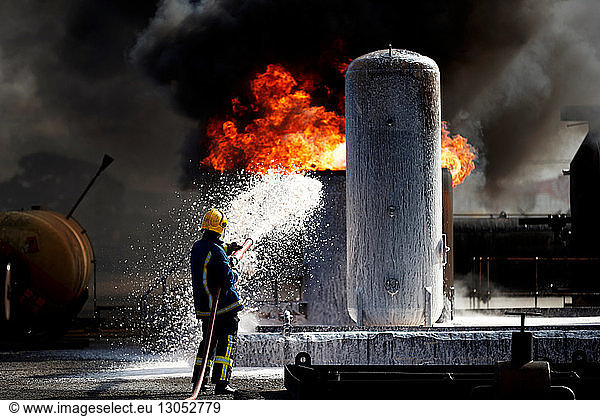 Fireman training to put out fire on burning tanks  Darlington  UK