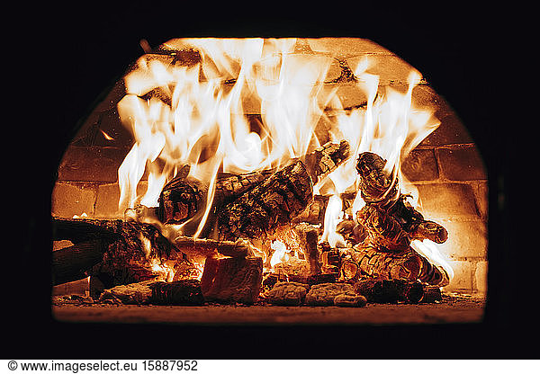 Firewood burning in pizza oven