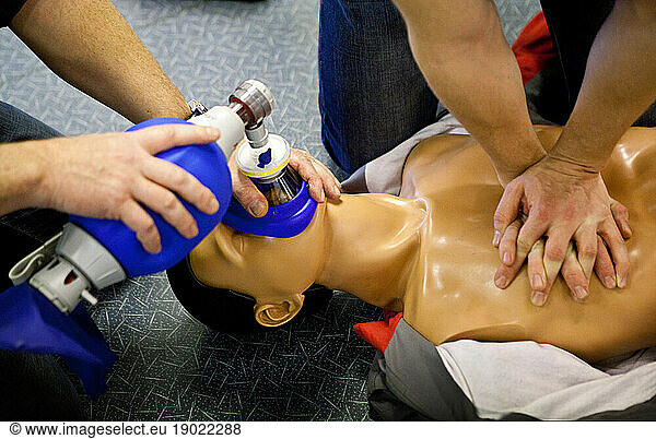 First aid training: alternate use of a manual resuscitator bag followed by cardiac massage.