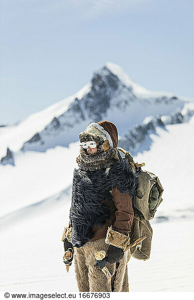 First Nations mountaineer exploring high altitudes  fur clothing.