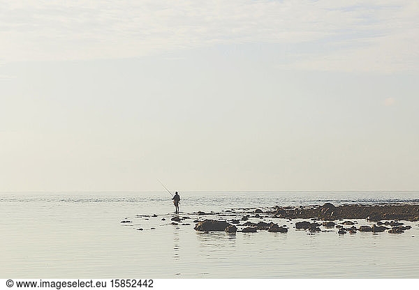 Fisherman at Indian Ocean coastline