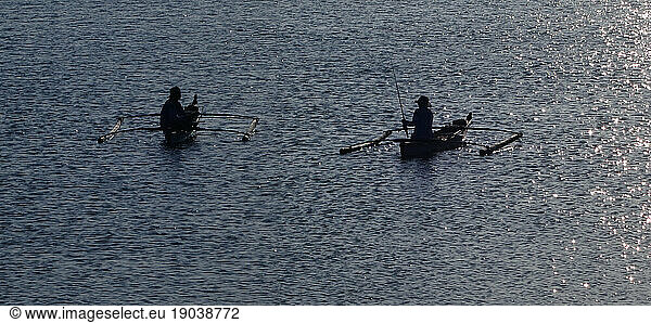 Fishermen in outrigger boats  Manila Bay  Philippines