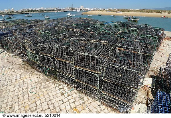 Fishers cages in Ferragudo harbour  Algarve  Portugal