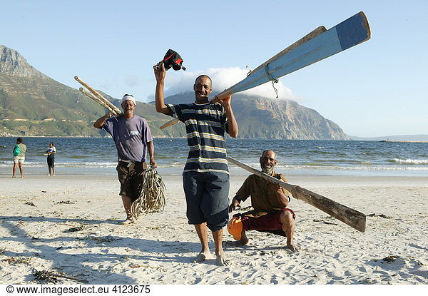 Fishers with paddles  Hout Bay near Cape Town   South Africa  Africa