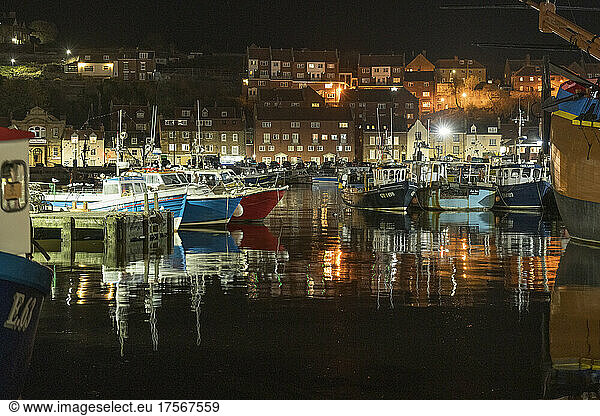 Fishing boats moored in Whitby harbour at night  Whitby  North Yorkshire  England  United Kingdom  Europe
