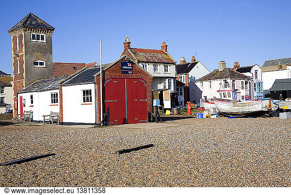 Fishing boats on the beach  Aldeburgh  Suffolk  England. Disused lifeboat building and look out tower.