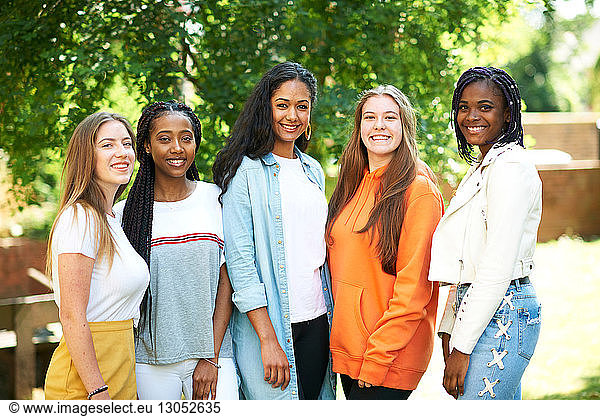 Five young women  higher education students on college campus  portrait