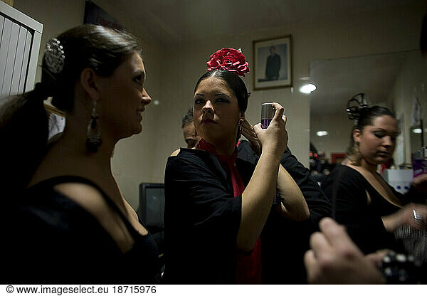 Flamenco dancers  or bailaores  and singers  or cantaores  get ready for a performance backstage in Cadiz  Andalusia  Spain.