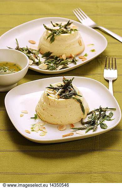 Flan made of Ricotta cheese with bruscandoli hop´s buds and toasted almond  Italy