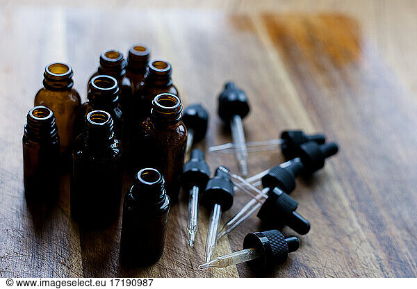 flat lay of empty glass amber dropper bottles