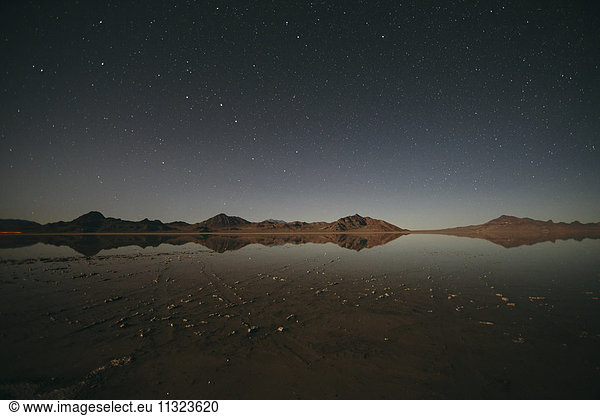 Flooded Bonneville Salt Flats at night  starry sky above