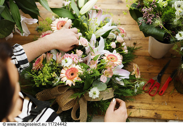 Florist making flower bouquet