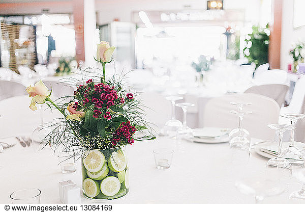 Flowers decorated in vase at restaurant table