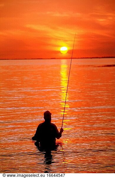 Fly rod fishing at sunset on Lake Okeechobe  Florida.