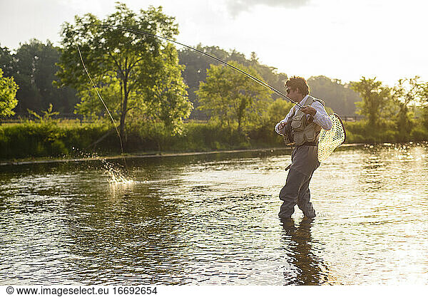 Flyfishing at sunset on a Southeastern river.