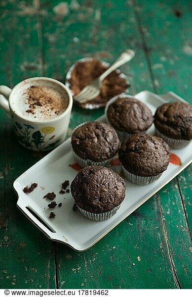 Food photography  chocolate muffins  freshly baked with latte