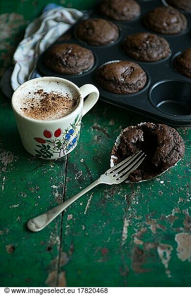 Food photography  chocolate muffins  freshly baked with latte