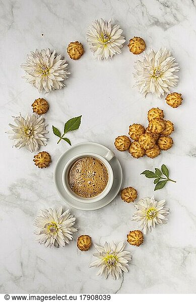 Food photography  coffee cup  with sweets and white dahlias (Dahlia)  from above