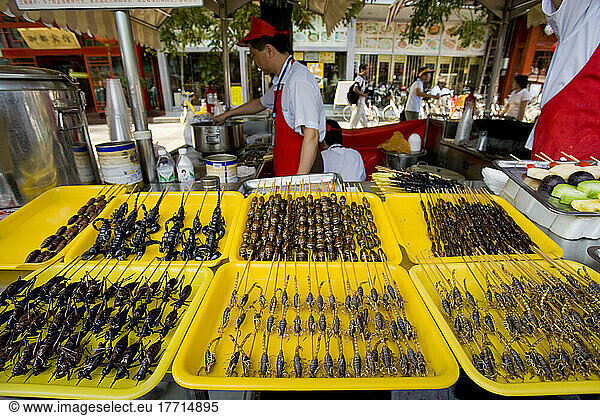 Food Vendors Offer Exotic Delicacies For Sale Along A Beijing Street  China