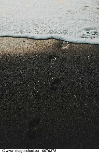 footprints on the black sand sea