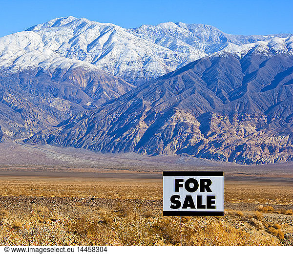 For Sale Sign in Mountainous  Desert Landscape