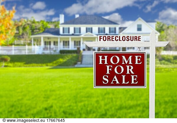 Foreclosure home for sale real estate sign in front of beautiful majestic house