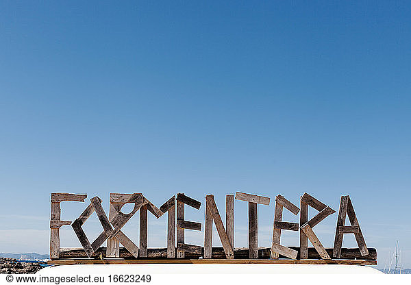 Formentera text against clear blue sky during sunny day