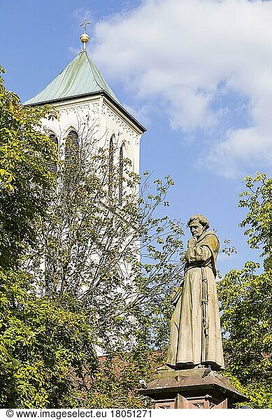 Fountain figure of Monk Berthold Schwarz on the town hall square  in the background the steeple of St. Martin's Church  Freiburg im Breisgau  Baden-Württemberg  Germany  Europe