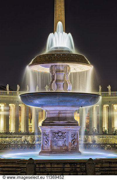 Fountain with cathedral at St Peter Square  Rome  Italy