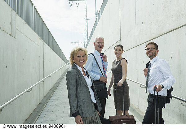 four colleagues on business travel