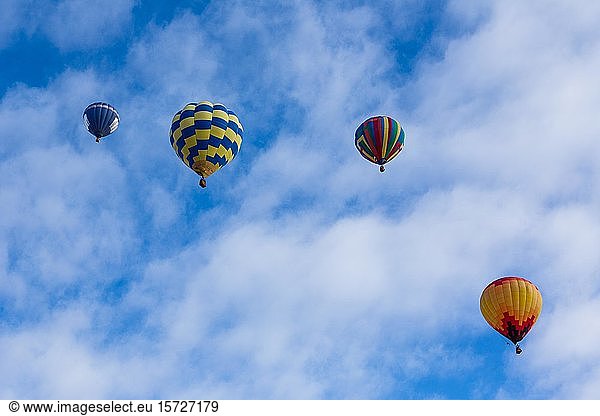 Four hot air balloons  Balloon Festival  Monument Valley Navajo Tribal Park  Arizona  USA  North America