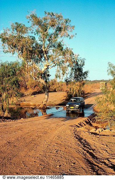 Four-wheel drive vehicle crossing Station Creek on the Chillagoe-Mungana road. Chillagoe-Mungana Caves National Park  Queensland  Australia. (Photo by: Auscape/UIG)