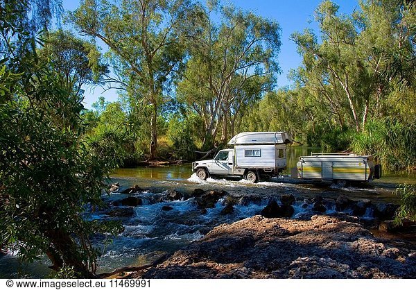 Four-wheel drive vehicle crossing the O'Shannassy River  fordable during the dry season but becoming impassible during the wet season  Near Boodjamulla National Park  Gulf Country  Queensland  Australia. (Photo by: Auscape/UIG)
