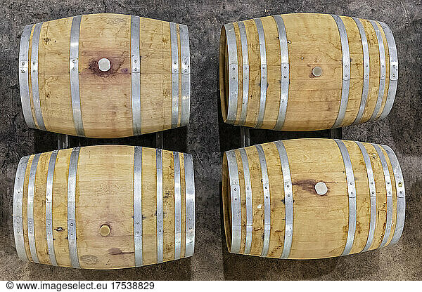 Four wine casks with metal reinforcements