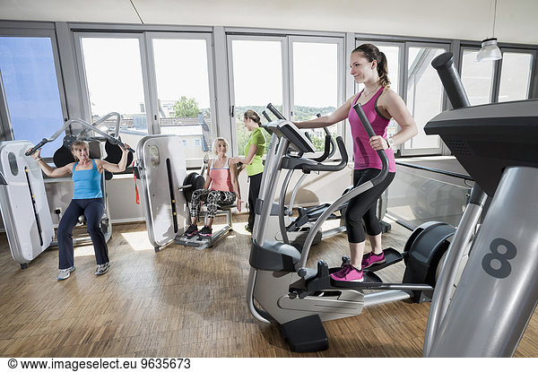 Four woman fitness studio modern sport