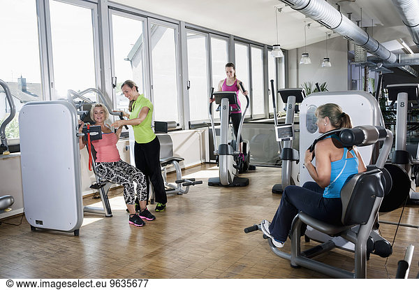 Four woman fitness studio trainer sport modern