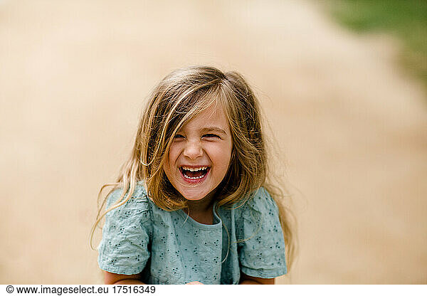 Four Year Old Laughing at Camera in San Diego