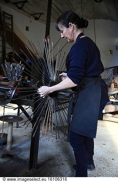 Frédérique Fert installing the machine used to make a scourtin  Nyons  Provence  France