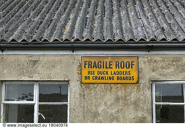 Fragile roof use duck ladders or crawling boards  former military building  Orford Ness  Suffolk  England  UK