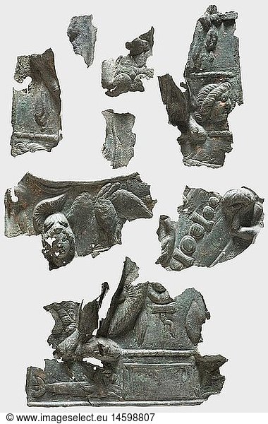 Fragments of a Roman ceremonial armour  2nd/3rd century A.D. Bronze with greenish patina. Three-dimensionally embossed with a helmeted animals and an insignia. Partially turned-under and holed edges. Fragmentarily existent with larger imperfections. Height ca. 20 cm.  historic  historical  ancient world  ancient world  ancient times  object  objects  stills  clipping  cut out  cut-out  cut-outs
