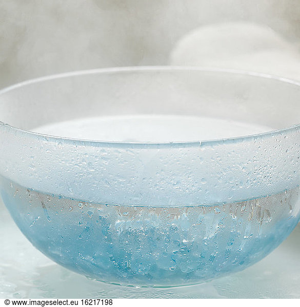 Fragrant crysals in bowl with hot water