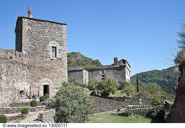 France, Aveyron, Parc Naturel Regional des Grands Causses (Natural Regional Park of Grands Causses), Route des Seigneurs, Brousse le Chateau, labelled Les Plus Beaux Villages de France (The Most Beautiful Villages of France), courtyard of the castle with the tower of the prisoner, 13th century