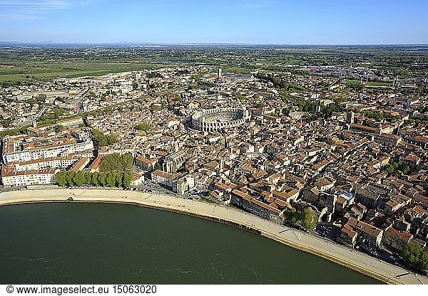 France,  Bouches du Rhone,  Arles,  dock Max Dormoy,  The Rhone and the city center with the arena,  Roman amphitheater (80/90 AD J-C.),  Historical monument,  UNESCO World Heritage (aerial view)
