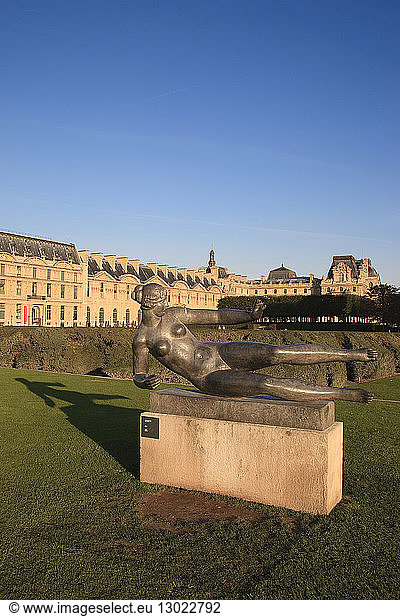 France,  Paris,  area listed as World Heritage by UNESCO,  sculpture by Aristide Maillol L'air in the Jardin des Tuileries and facade of the Louvre museum