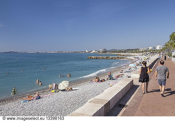 France  Alpes Maritimes  Cagnes sur Mer  couple walking on the beach promenade