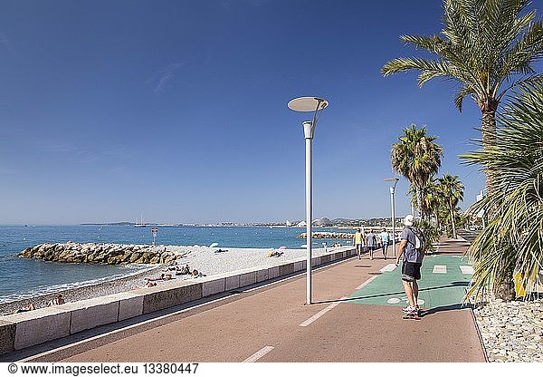 France  Alpes Maritimes  Cagnes sur Mer  man riding skateboard on the beach promenade