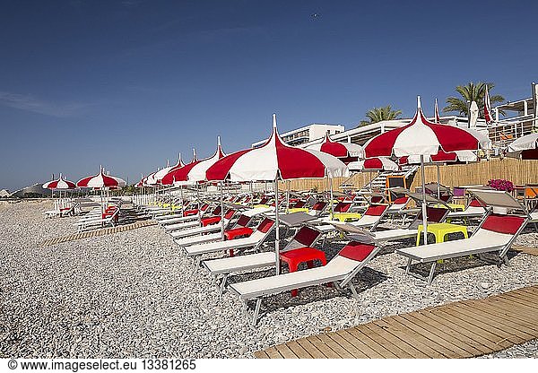 France  Alpes Maritimes  Cagnes sur Mer  sunbeds and parasols of the stone beach
