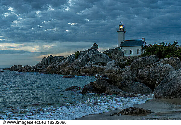 France  Brittany  Plouneour-Brignogan-Plages  Phare de Pontusval lighthouse at cloudy dusk