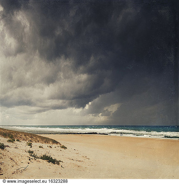 France  Contis-Plage  man at the beach  thunderclouds