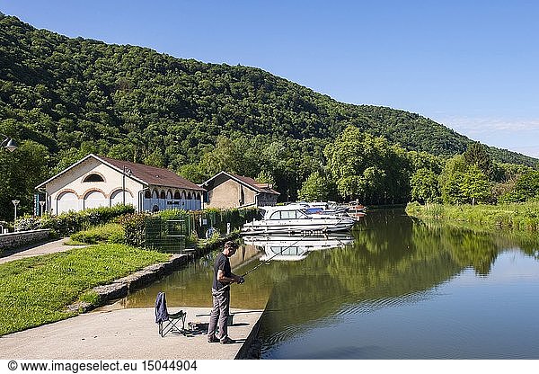 France  Doubs  Baumes Les Dames  veloroute  euro bike 6  the Rhine Canal Rhone through the charming village of Deluz  here the river port and angler